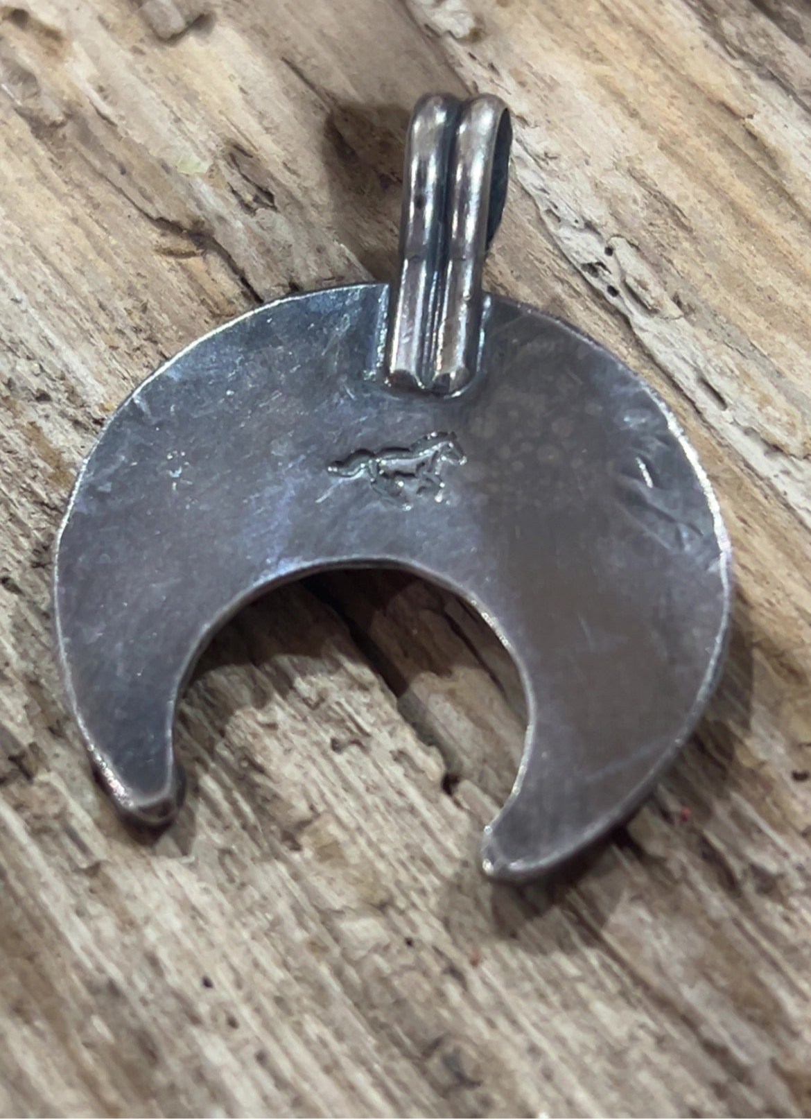 Sterling Naja with running horse marking