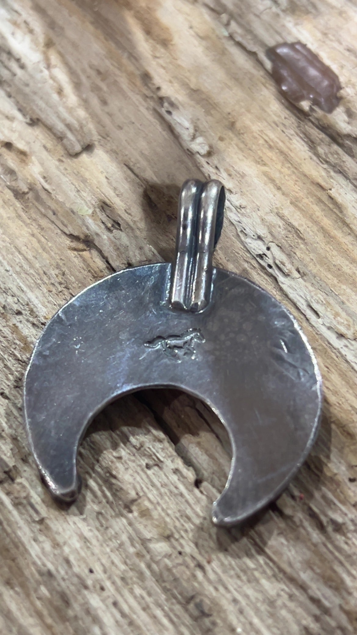 Sterling Naja with running horse marking